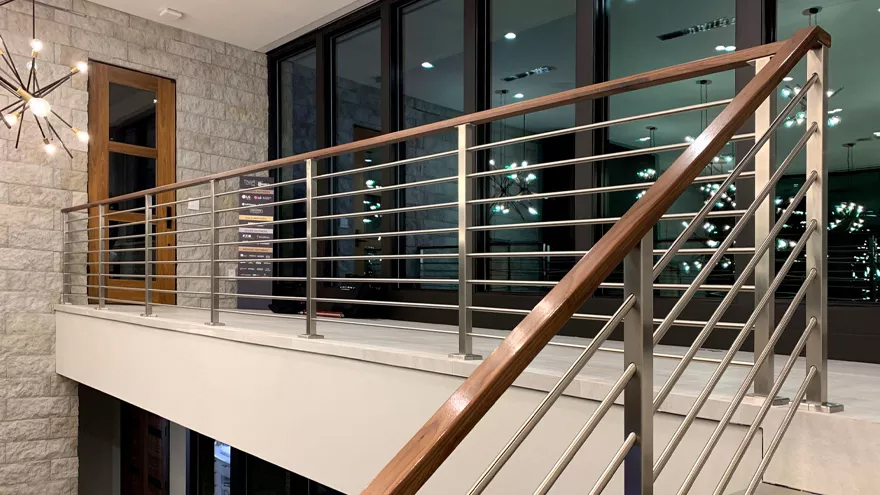 Beautiful Olympus horizontal stair rail with a flat wood handrail.