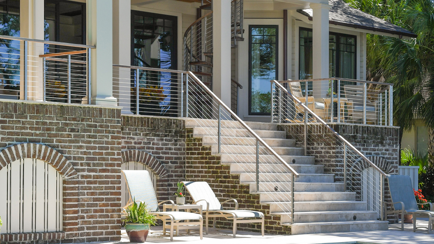 Railing on patio staeps. The cable railing is installed on concrete.