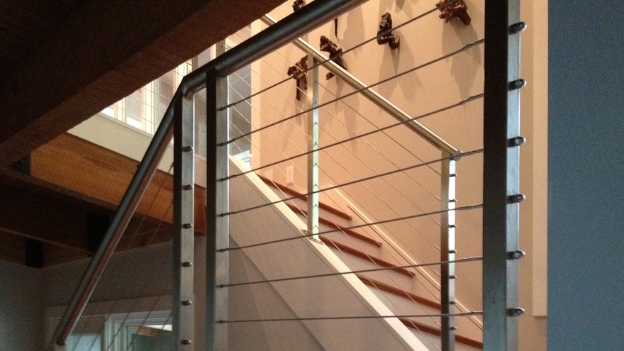 Cable railing system installed in South Carolina. Dog leg stairs with cable railing system in Greenville County