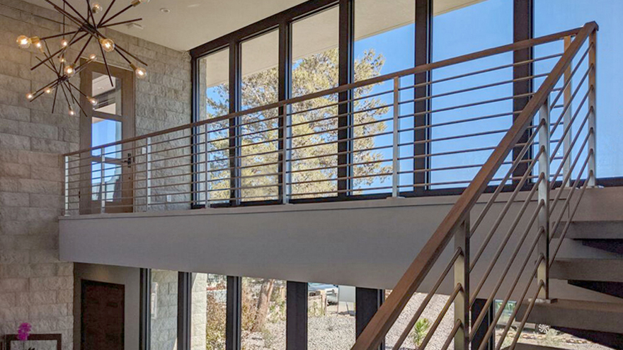 Horizontal bar railing on stairs.