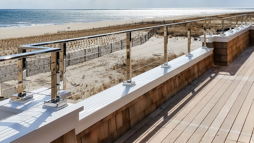 Mirror finish parapet wall cable railing system