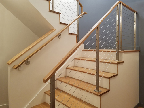 Cable railing on switchback stairs.