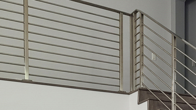 San Clemente, CA, a modern stainless railing, is the perfect staircase design for a high-end custom home. The San Clemente staircase remodel was completed using an easy-to-install prefabricated rod railing.
