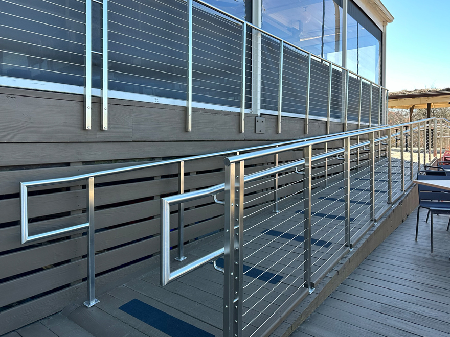 The ADA grab bar height meets the code on this wheelchair ramp.
