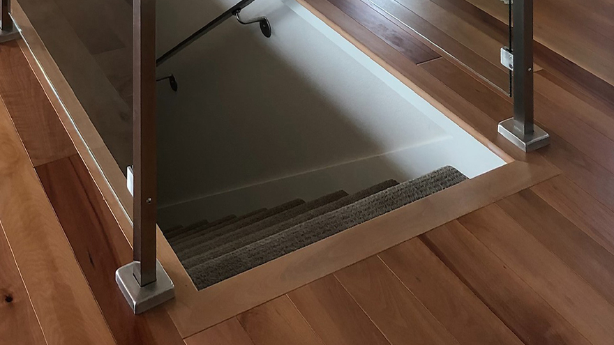 A glass banister gives a modern appearance to a home. Stainless glass railing can be powder coated or have a custom finish.