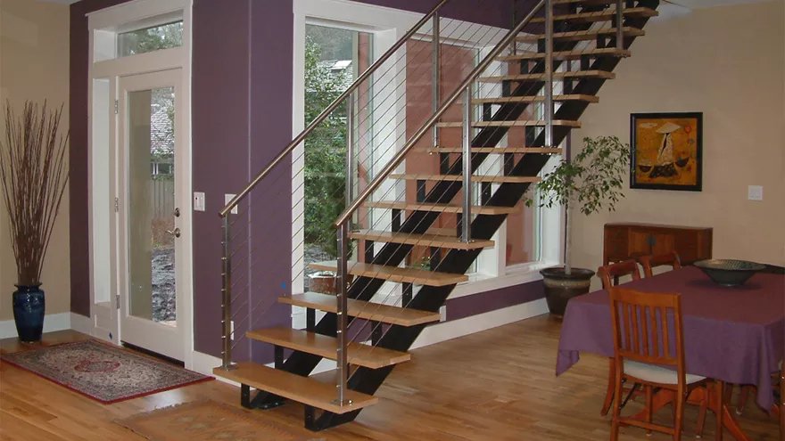 A modern steel stair railing design with an open staircases are popular modern stair designs.